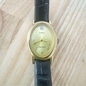 Timex ladies oval diamond gold tone black leather dress watch NEW BATTERY